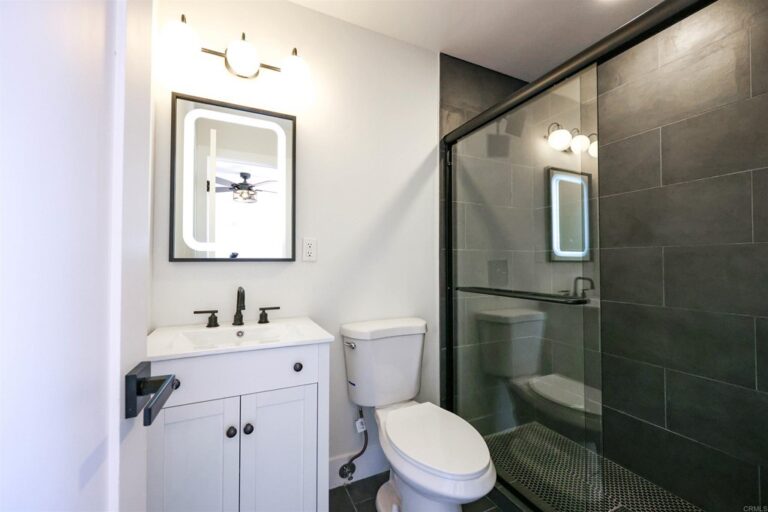 white bathroom with stand up shower