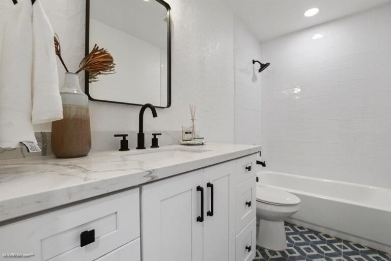 bathroom with gray counters